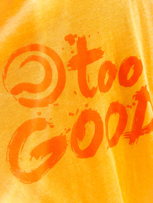 Extreme close up shot of a Too Good graphic on a bright yellow shirt.